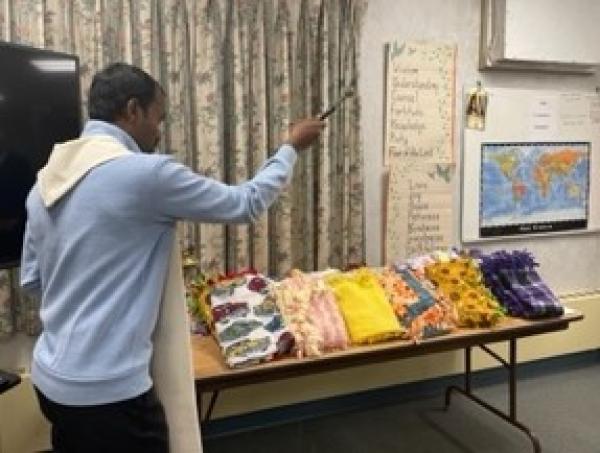 During the Court's November 4 meeting, Fr. Thomas blesses the prayer blankets made on Make A Difference Day.